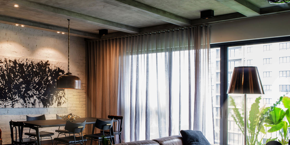 living room with ceiling spotlights, floor lamp and pendant