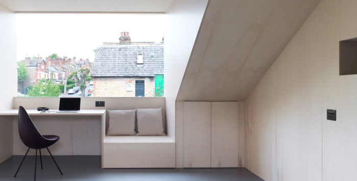 Loft room lined in pale poplar plywood