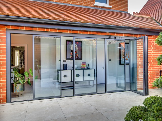 slide and turn doors on a red brick extension