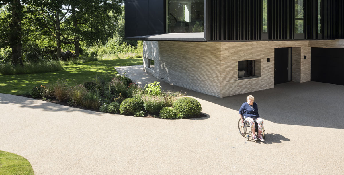 Accessible home design - Jo Wright outside her wheelchair friendly home in Hampshire