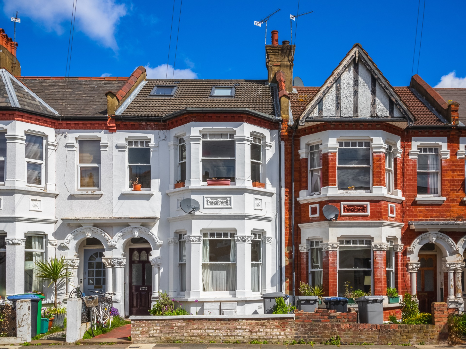 A row of Victorian terrace houses with two bays