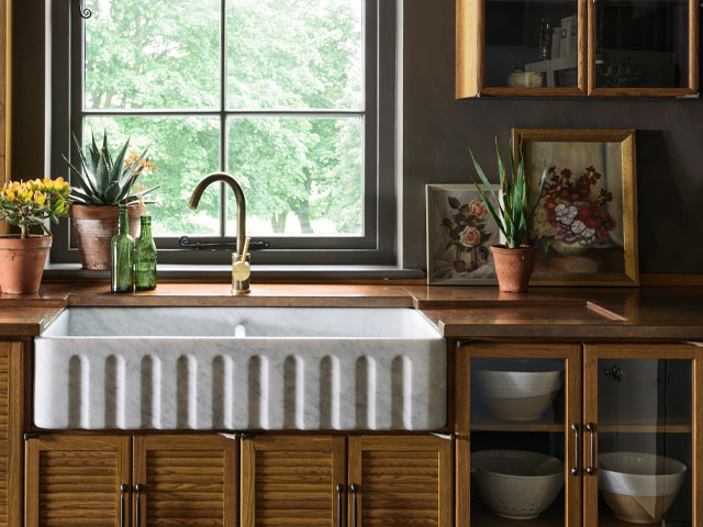 Haberdasher’s kitchen with bespoke aged copper worksurface and integrated drainer, Devol. Sustainable kitchen worktop