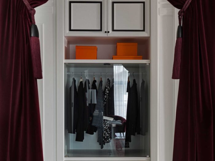 A dramatic way of zoning the bedroom and wardrobe is with a velvet curtain