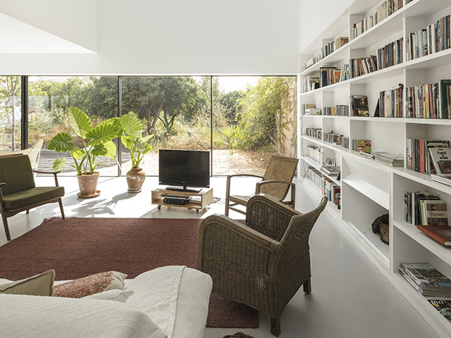 Portuguese winery conversion living room with long glazed doors - grand designs