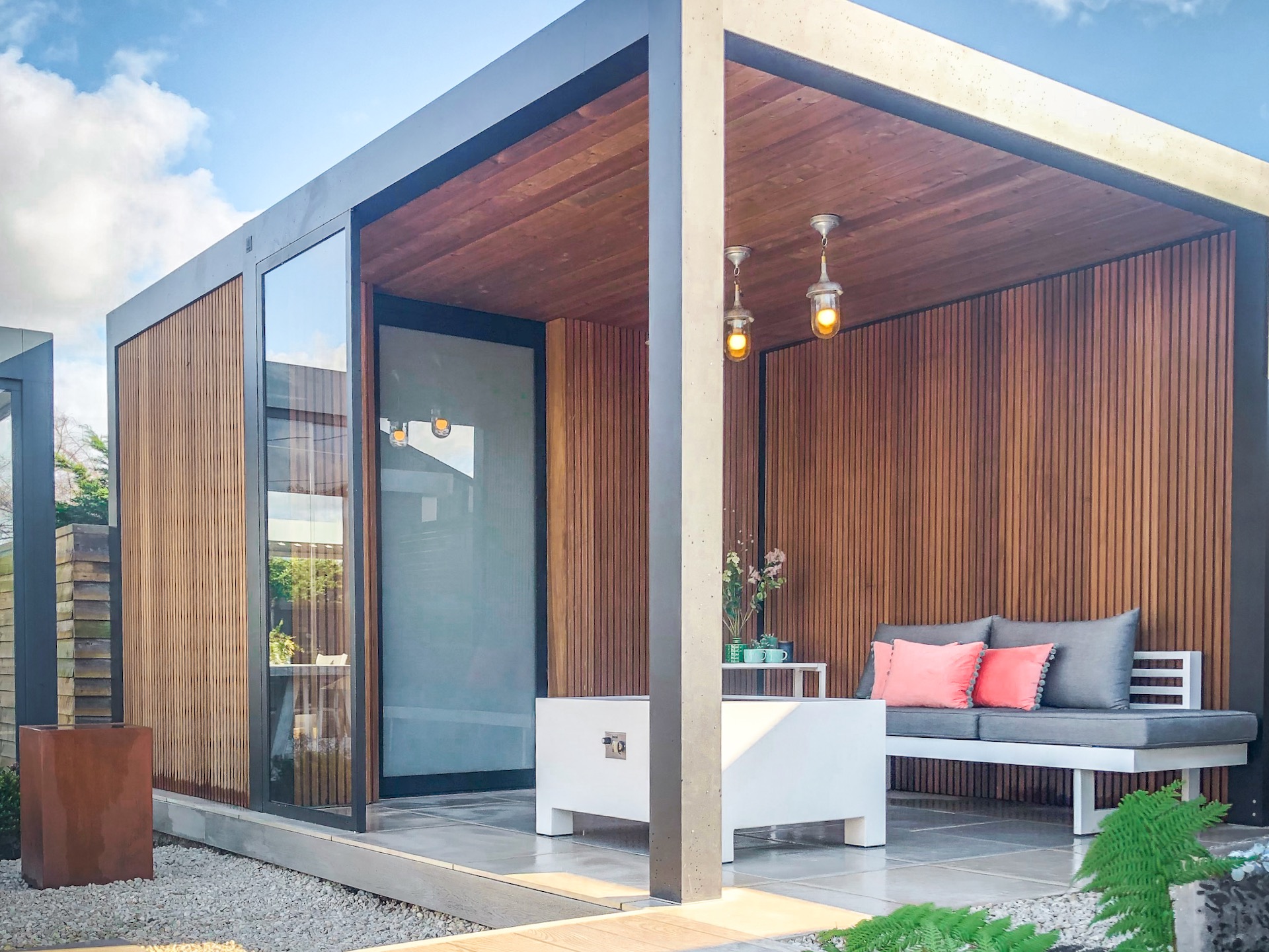 Steel and timber gazebo and garden room with two open elevations.