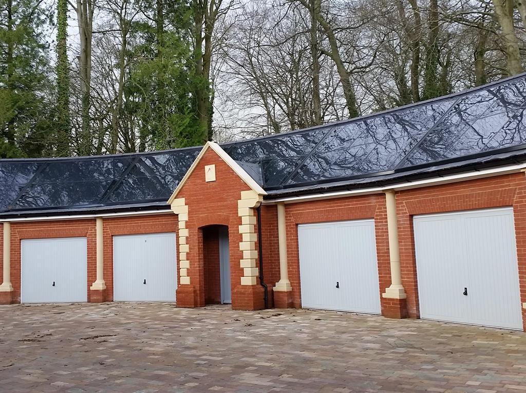 A GB-Sol Infinity Solar Roof on a curving garage block