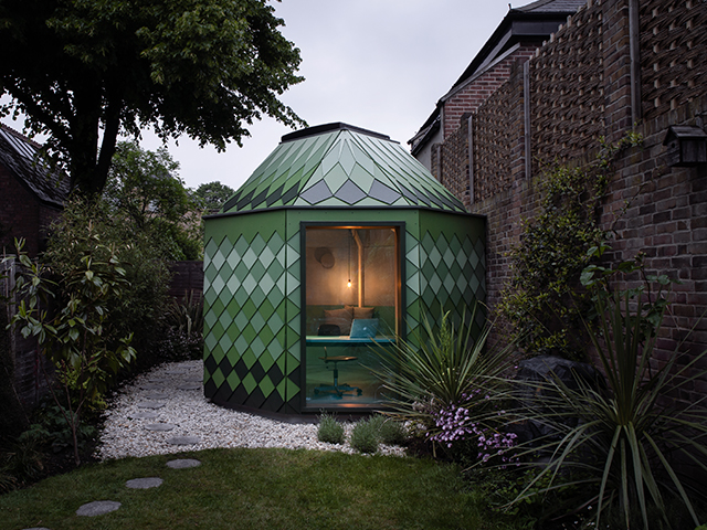 An exterior view of the garden studio with window onto the interior