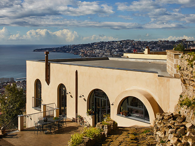 exterior of converted monastery on naples italy hill - grand designs 