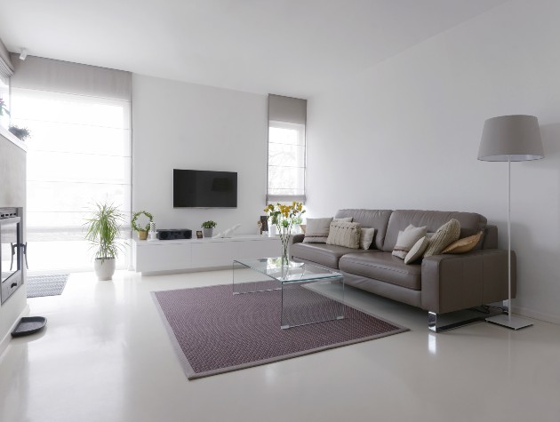 lounge with resin floor sofa rug and perspex coffee table