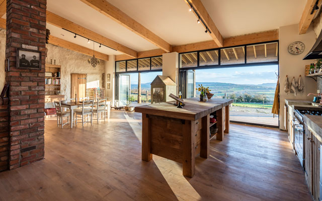 The interior of the converted cowshed looking across the open-plan kitchen