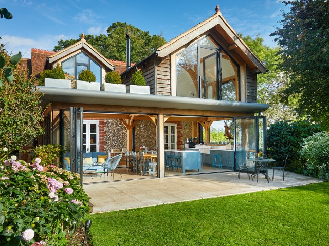 country cottage extended with floor to ceiling bifold doors taking up an entire wall