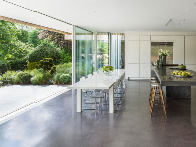 polished concrete floor running from kitchen to outdoor terrace