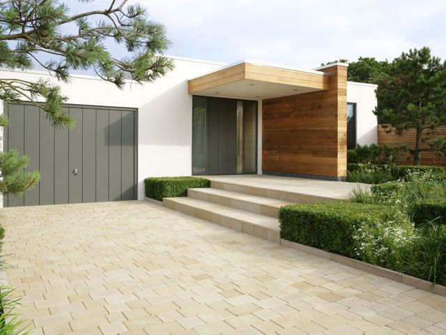 Stonemarket Beachside Setts driveway modern house - If the slope of the driveway is towards the house, all installed paving and drainage should be 150mm below the damp-proof course. You can’t run your new drainage system into an existing one without getting planning permission. For new-build properties, if you replace a free draining area with hard-standing, permission is normally required.