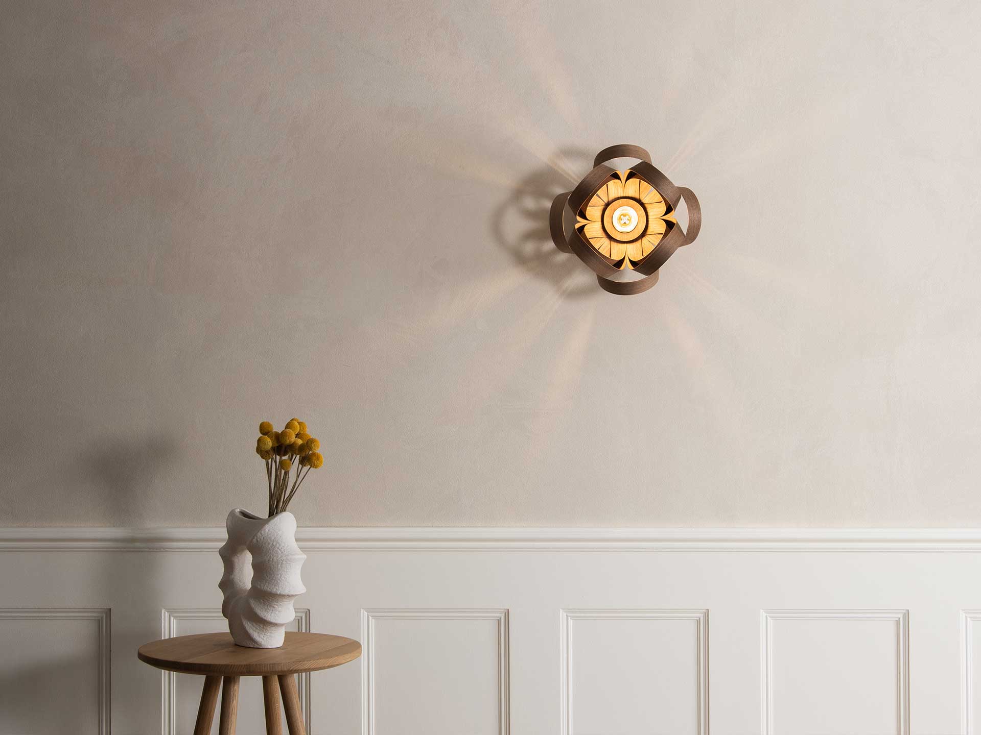 Bring a statement wall light in above chic panelling