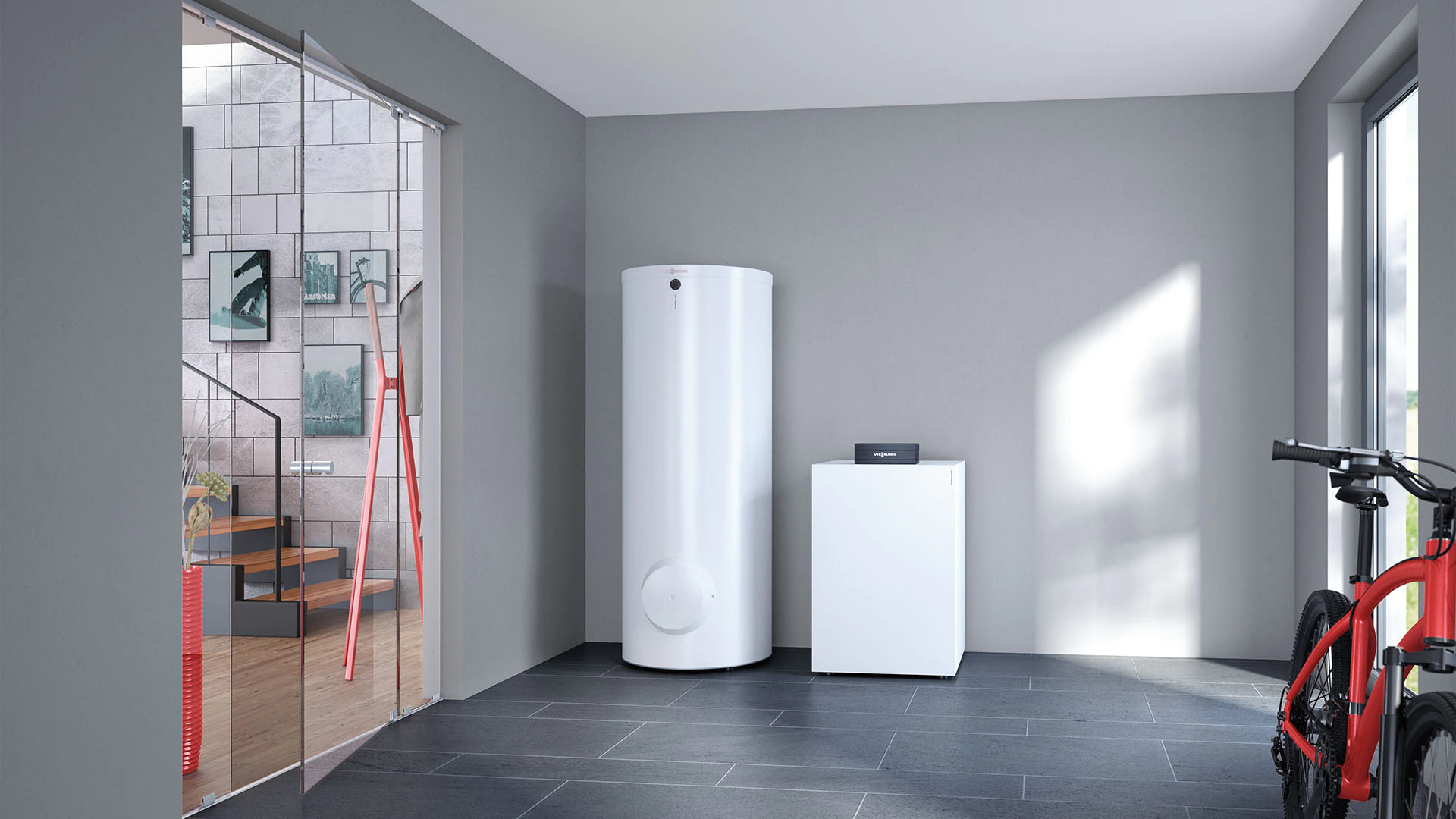 A ground-source heat pump and water cylinder in a utility room